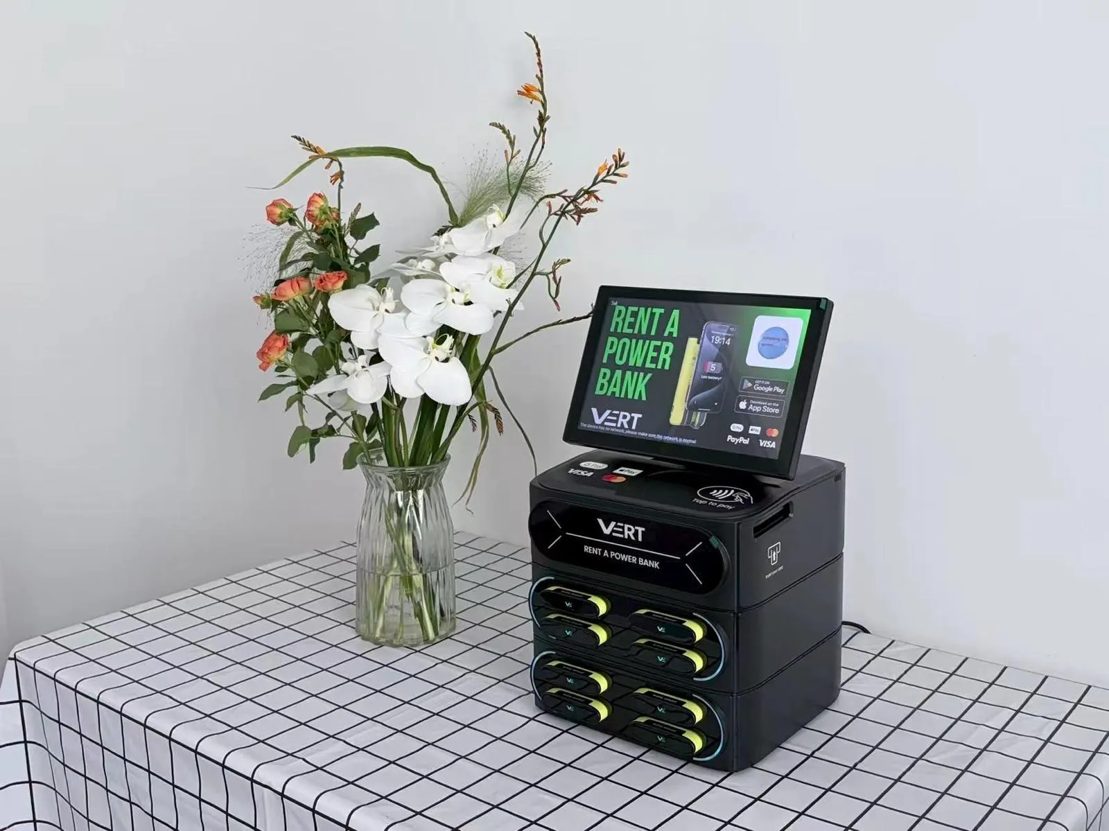 VERT desk station beside a vase of flowers