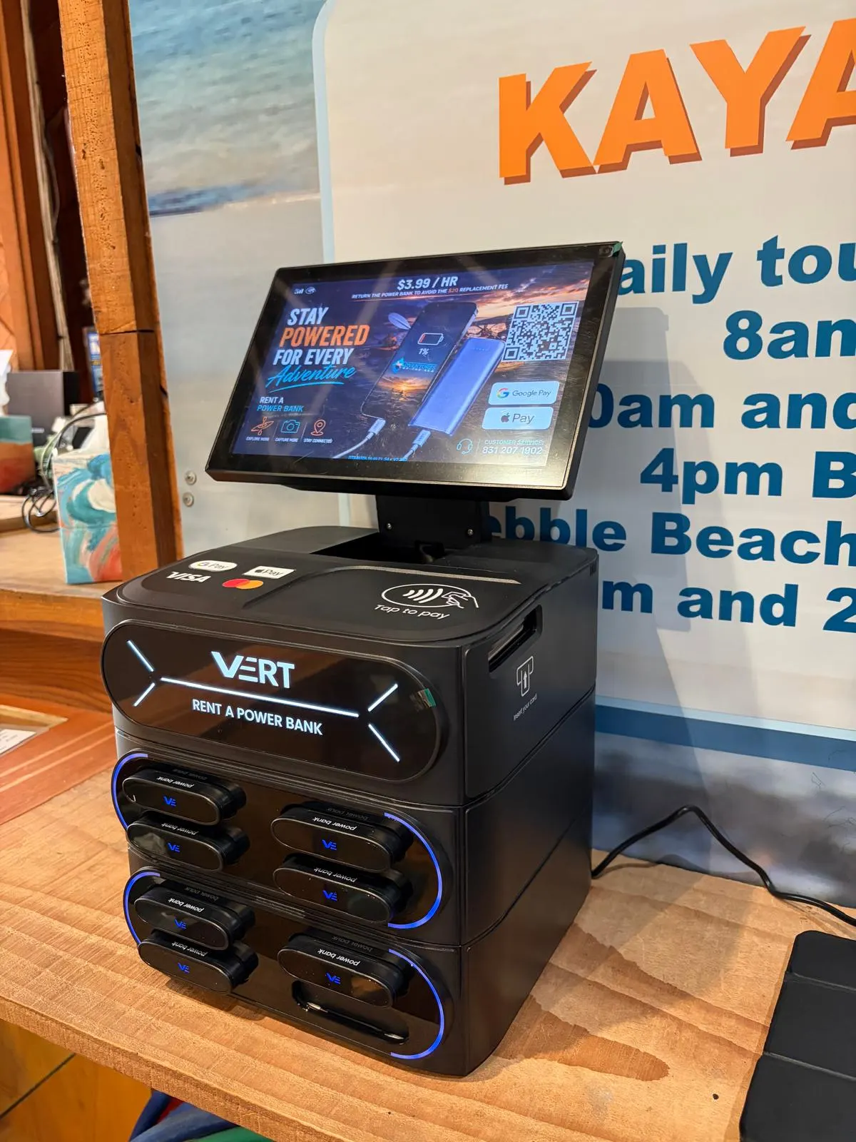VERT station on a wooden counter beside a kayak sign